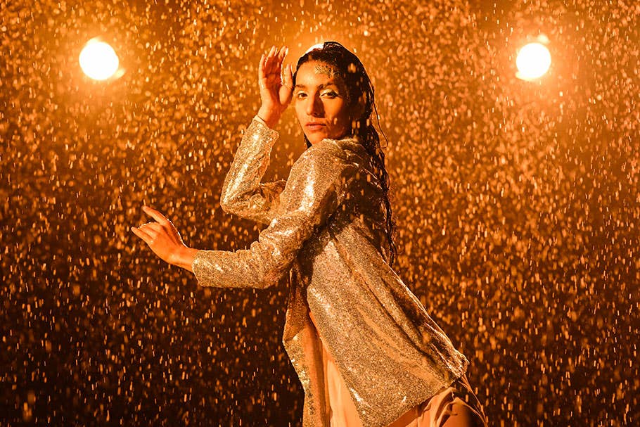 Woman Posing in Golden Rain | Nikon Cameras, Lenses & Accessories